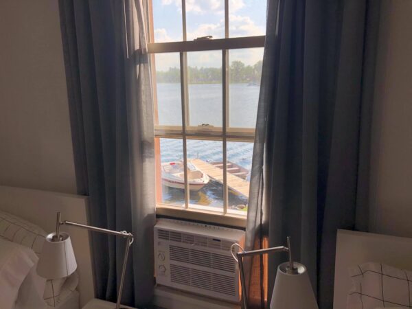 A window with a view of the water from inside.