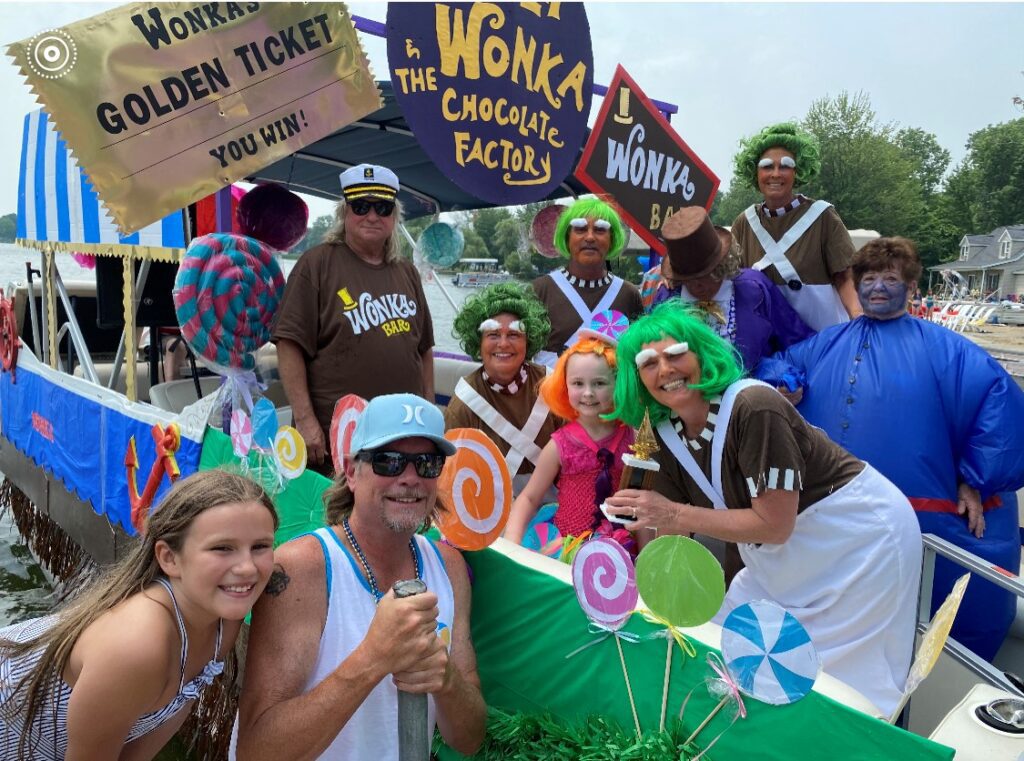 A group of people in costumes on floats.
