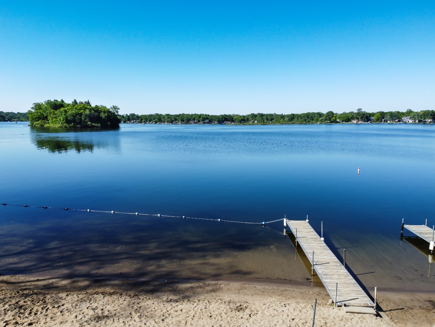 A dock on the shore of a lake.